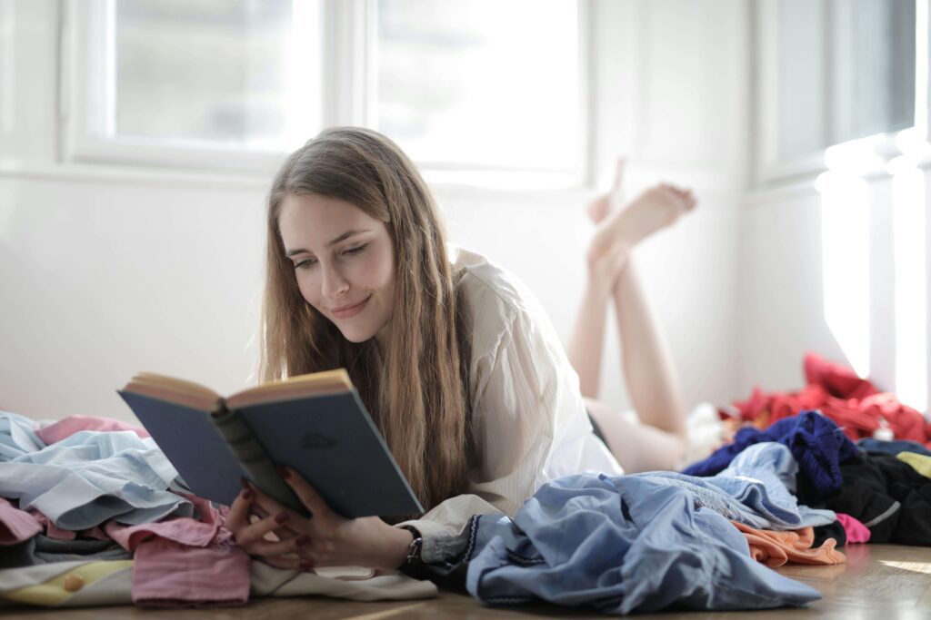 Woman reading a novel on her bed