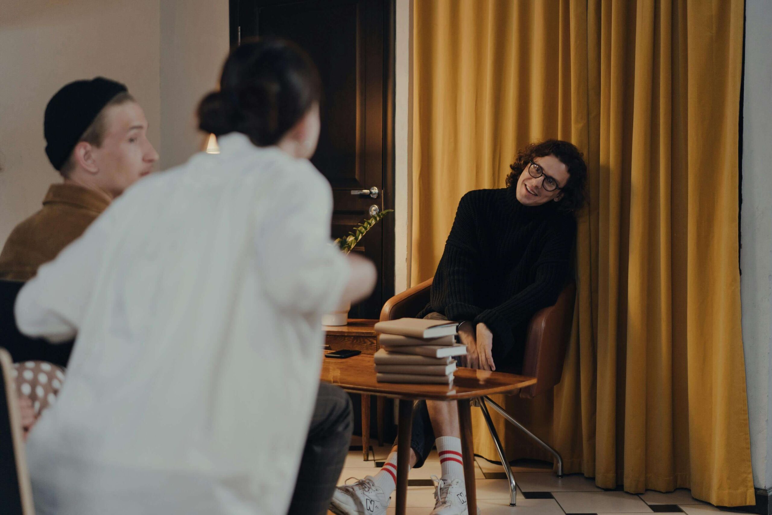 author happily talking to his fans during a book-signing event