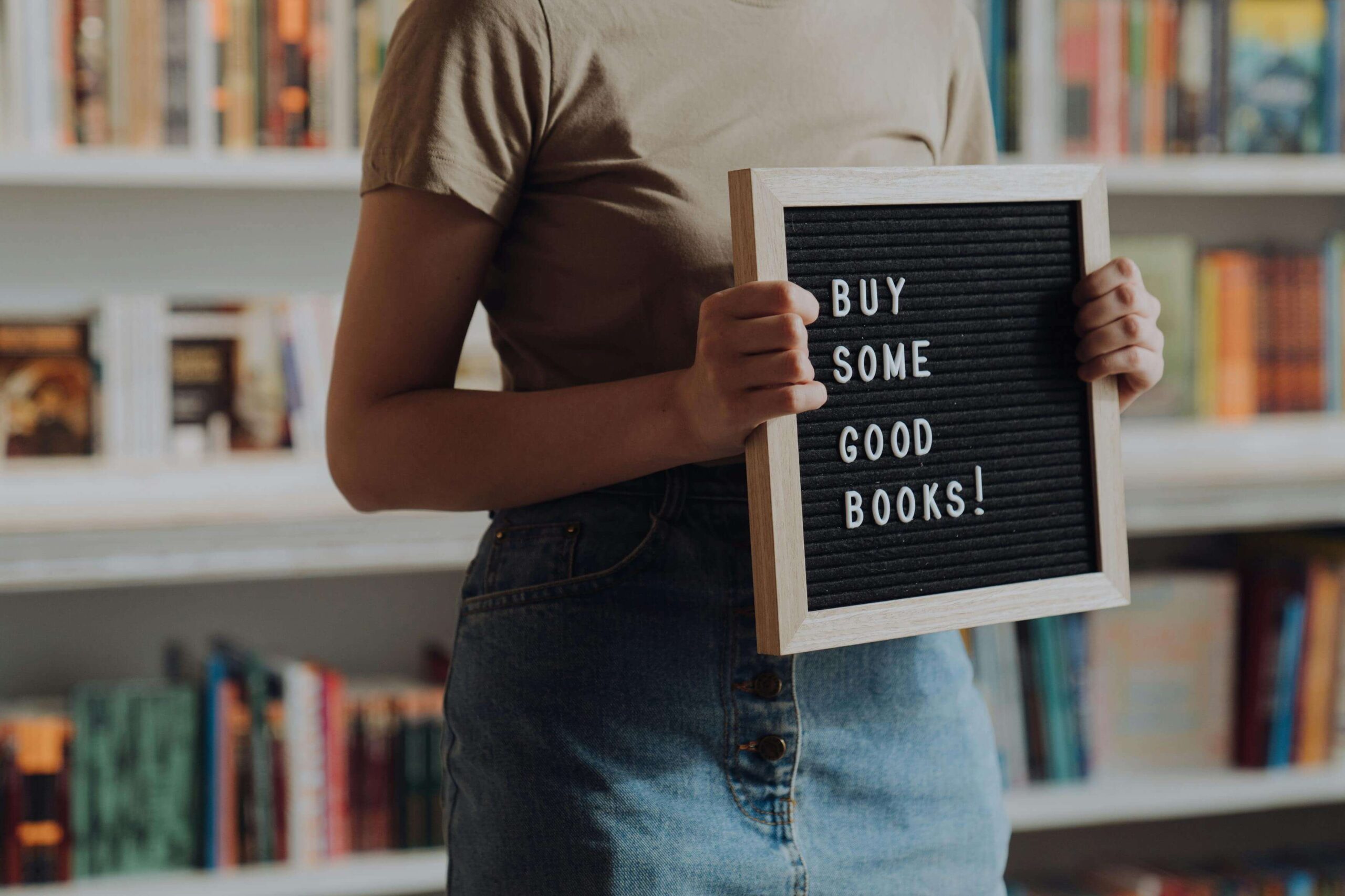 Author selling books in a bookstore