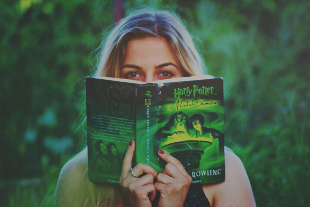 woman reading a Harry Potter book