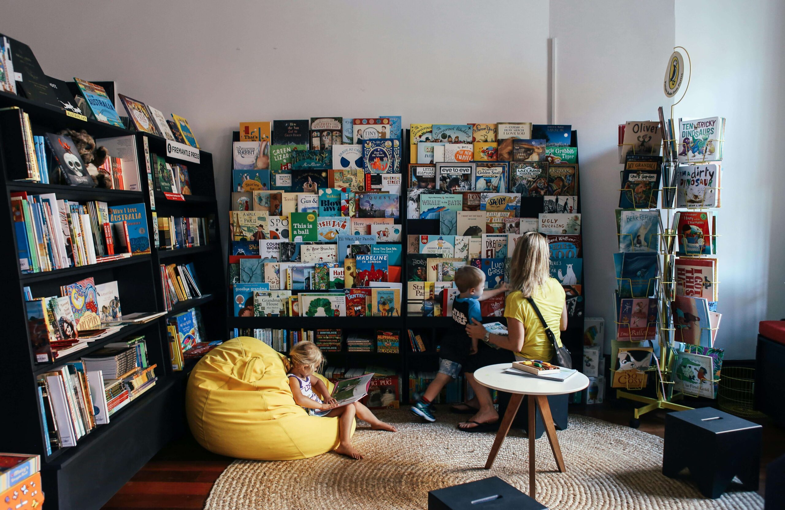 Mother and child looking for a picture book in a children's bookstore