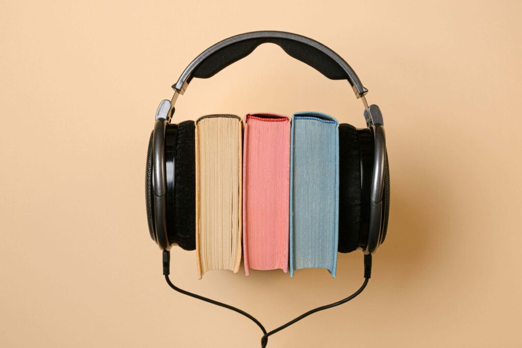 books sandwiched by a headset