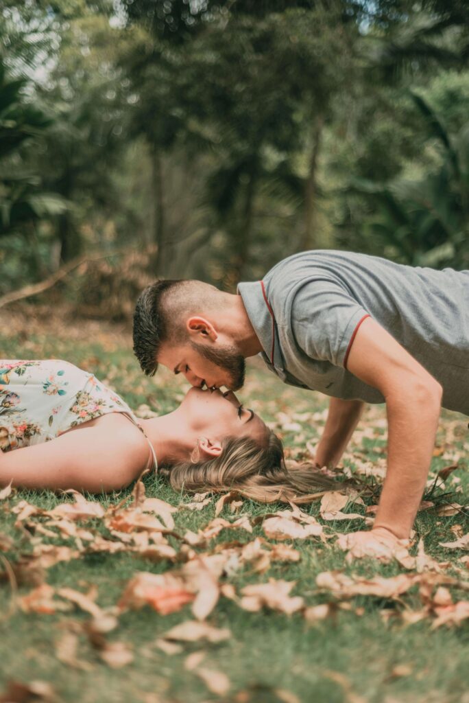 couple kissing on the ground