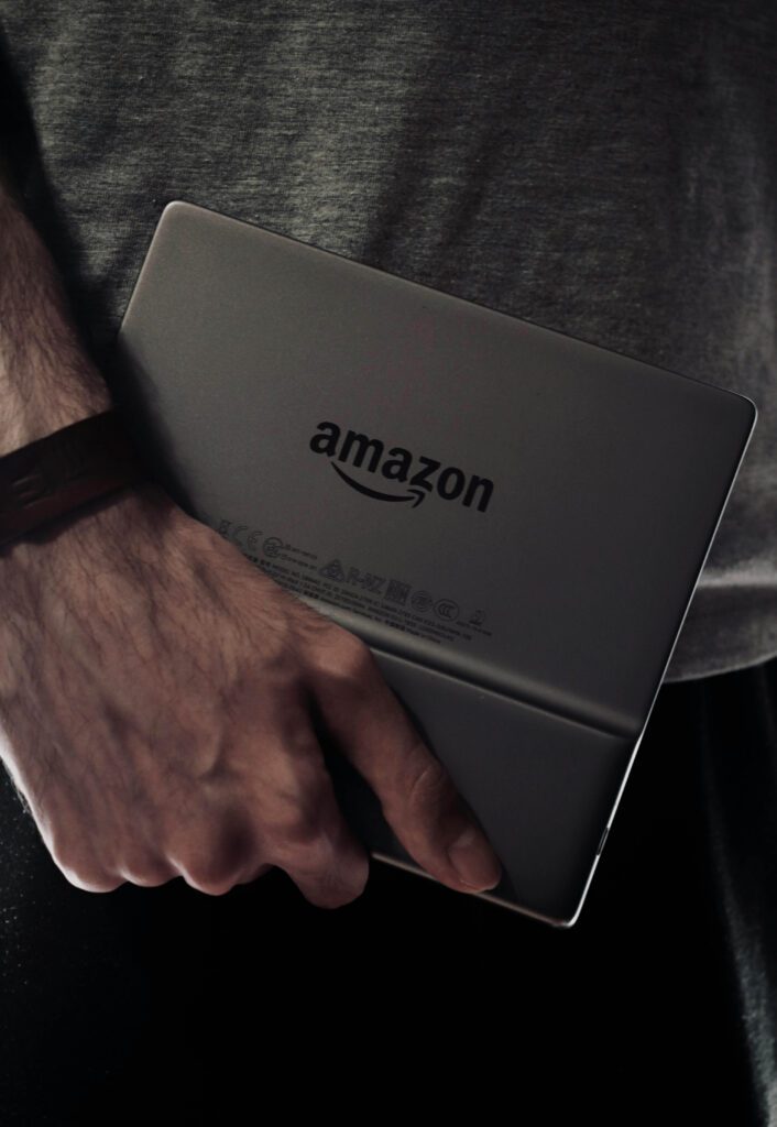 reader holding an amazon kindle reader