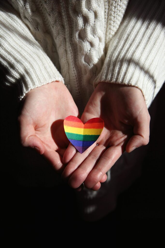 heart-shaped piece of paper with the rainbow color symbolizing pride lgbtq